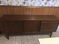 Front view of the retro sideboard cabinet showing sliding doors and drawers.