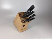 Wusthof wooden knife block containing knives
