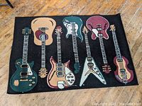 Full view of the throw rug showing all guitar illustrations