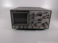 Front view of Heath Model 4226 oscilloscope showing screen, control knobs, and input connectors.