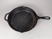 Top view of the cast iron skillet showing the cooking surface for condition assessment.