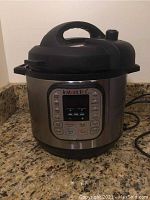 Front view of the Instant Pot electric pressure cooker on countertop.