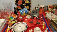 Crab serving bowls, crab-shaped bowls, crab dip bowl with spreader, salt and pepper shakers, and other assorted crab and seafood novelty items arranged on a table.