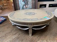 Front view of the oval coffee table in room setting
