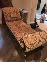 Full view of chaise lounge showing profile and upholstery pattern