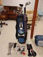 Full lot view showing clubs in bag and accessories on floor.