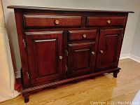 Front view showing two drawers and three cabinet doors