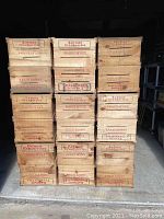 Front view of stacked wooden cranberry crates labeled Eatmor Cranberries.