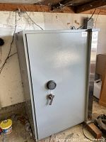 Safe closed, showing exterior with electronic keypad and lever handle