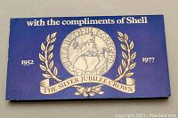 Blue presentation envelope with Shell branding and Silver Jubilee Crown design from 1952-1977.