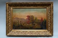 Full view of old framed oil painting showing landscape scene with teepees and a cabin amidst fall trees with decorative gold frame.
