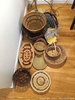 Top view of baskets group showing various styles including oval, round, shallow, and two plastic-lined ones.