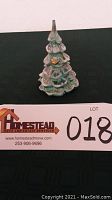 Front view of the iridescent glass Christmas tree showing bird detail