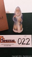 Front view of the handpainted Burmese sanded glass Santa figurine with original box visible.