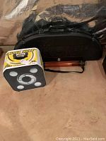 Black hard shell bow case, Black Hole archery target and orange arrow holder tube