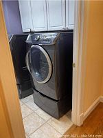 Front view of dryer in laundry space