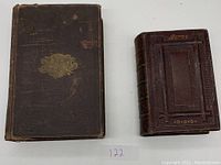 Shows both books side by side, illustrating size and cover details.