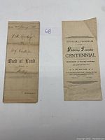 Front side of the 1873 Deed of Land and the 1911 Pickering Township Centennial official program together showing title and overall condition.