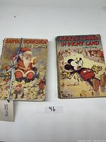 Two vintage Walt Disney children's books side by side showing illustrated covers and condition