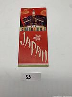 Front cover of the pamphlet showing a traditional Japanese figure and the word 'JAPAN' on a red background.