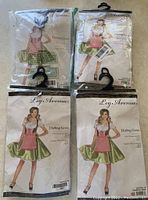 Front packaging view of two unopened Leg Avenue Darling Greta costume packages and two opened but unused costumes