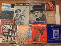 Full lot overview showing 10 magazines and booklets related to militaria, guns, ammo, and wartime history.