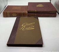 Four books arranged with Glimpses of the Unseen in front, two Punch bound volumes stacked side by side, and History of Canada book to the left.