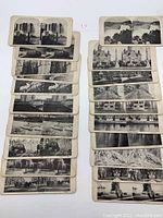 Photo showing all 20 black and white stereoscope viewing cards arranged in two columns with various Canadian locations and landmarks visible.