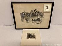 Framed etching showing a stagecoach pulled by horses against a mountainous background, with a smaller unframed etching print laid below it.