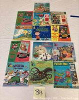 Overview of 13 children's storybooks with illustrated covers, each paired with a vinyl record for read-along sessions. Titles and cover art visible include The Wizard of Oz, A Charlie Brown Christmas, and others.