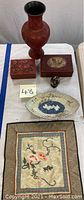 Full lot showing vase, carved boxes, small figurine, porcelain dish and textile