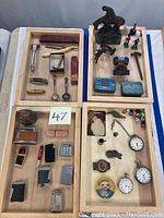 Overview of all four wooden trays displaying the full assortment of items
