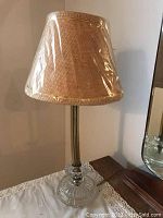 Pair of vintage table lamps showing overall height, shape and shade texture.