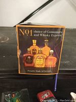 Box showing the front with images of Crown Royal bottles and 'No.1 choice of consumers and whisky experts' text