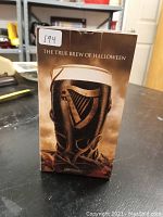 Box of the Guinness beer glass showing Halloween theme with text 'The True Brew of Halloween' and image of the glass filled with dark beer.