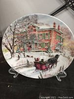 Front view of Stewart Sherwood 6115B collector plate depicting a Victorian Christmas scene with house, trees, sleigh, and birds.