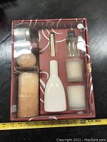 Full kit in original box showing candle, diffuser bottle, holder, snuffer and sticks