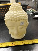 Front view of vintage ceramic Buddha head showing size and detail of curls and facial features
