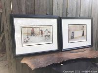 Two framed hockey-themed prints by John Newby displayed side by side on a rustic wood surface.