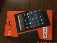 Front of original orange retail box labeled Fire HD10 showing tablet display image