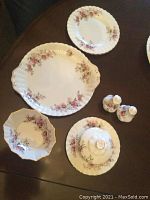 Top-down view of the full set of Royal Albert bone china serving pieces showing all items arranged on a table.