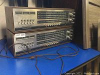 Two identical Telefunken Concertino HiFi stereo receiver units stacked on a shelf showing front panel and controls.