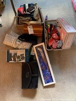 Wide view of lot showing handbags, socks, wrist brace, cedar chest, anti-slip foot control packages, and Magic Bag box