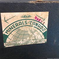 Close-up photo of Minerals of Canada collection box label, indicating the source and collection series.