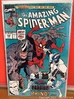 Front cover of The Amazing Spider-Man #344 comic book showing Spider-Man, Rhino, and Cardiac characters with vibrant colors and Marvel Comics logo.