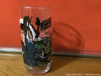 Clear collectible glass with Han Solo and Yoda artwork and Empire Strikes Back logo