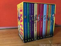 Collector's boxed set containing 15 hardcover Roald Dahl books arranged tightly inside a yellow box with colorful spines visible on one side.