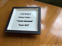 Top view of square dish showing printed message