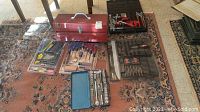 Whole lot arranged on floor including My Buddy toolbox, various hand tools, and tool sets.