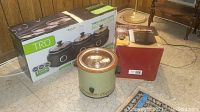 All three slow cookers shown together with original box for Tru slow cooker and additional boxes for Rival and Durabrand units.